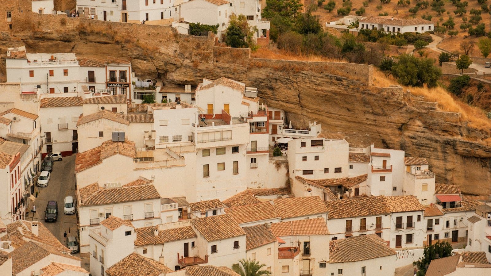 Whitewashed houses on a sun-drenched hillside in an Andalusian village