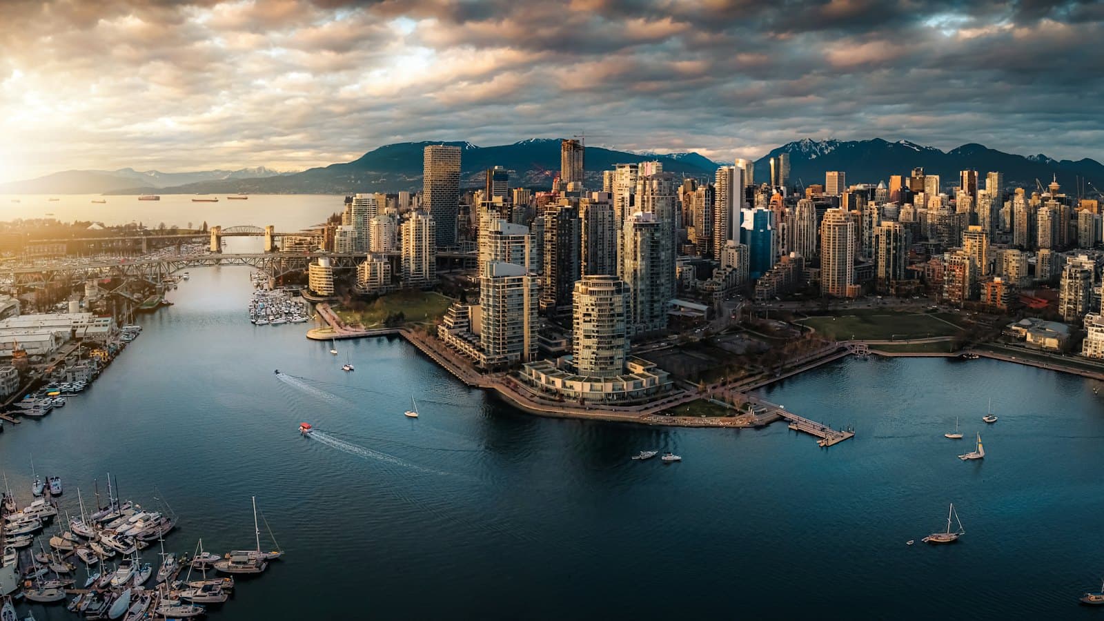 Aerial view of the False Creek waterfront and Vancouver skyline at golden hour