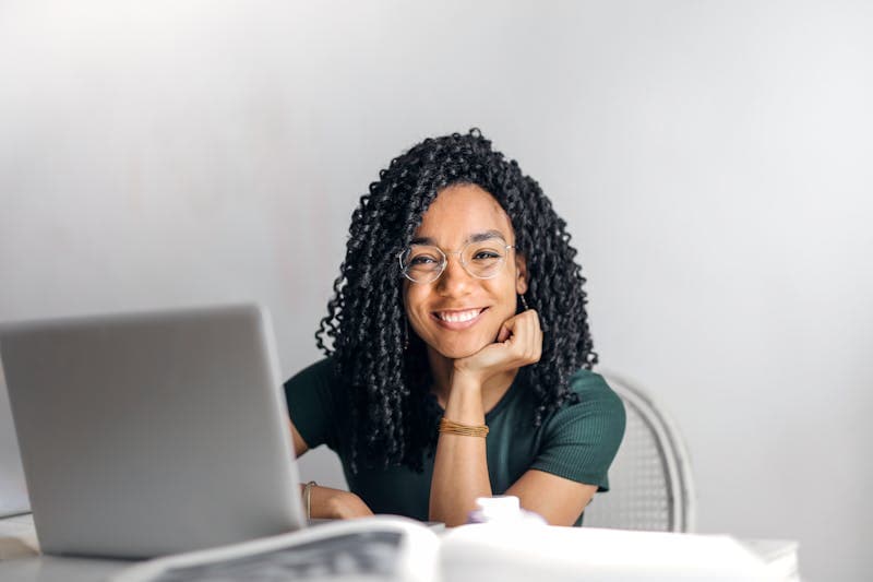 A woman planning her move at her laptop