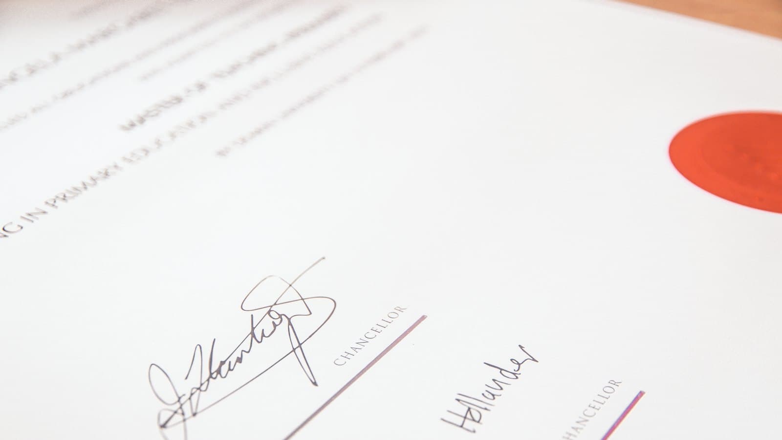 University degree certificate with a red seal and two signatures
