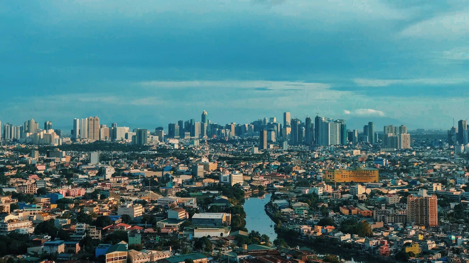 Manila city skyline under a clear blue sky