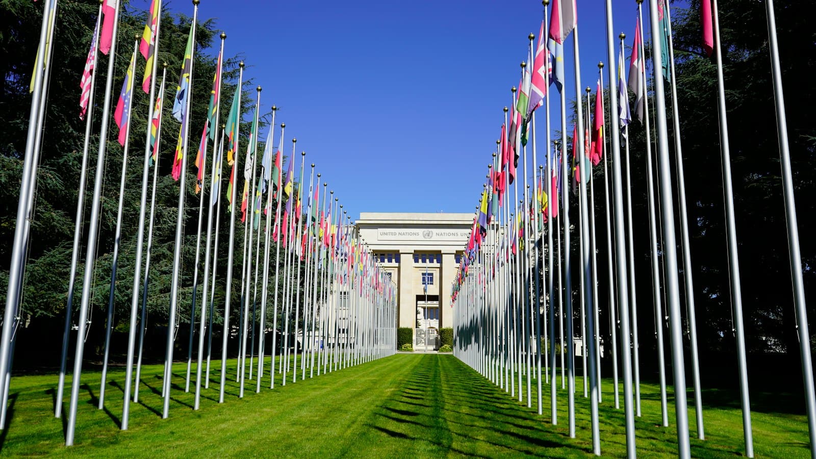 The avenue of member-state flags leading to the United Nations office in Geneva