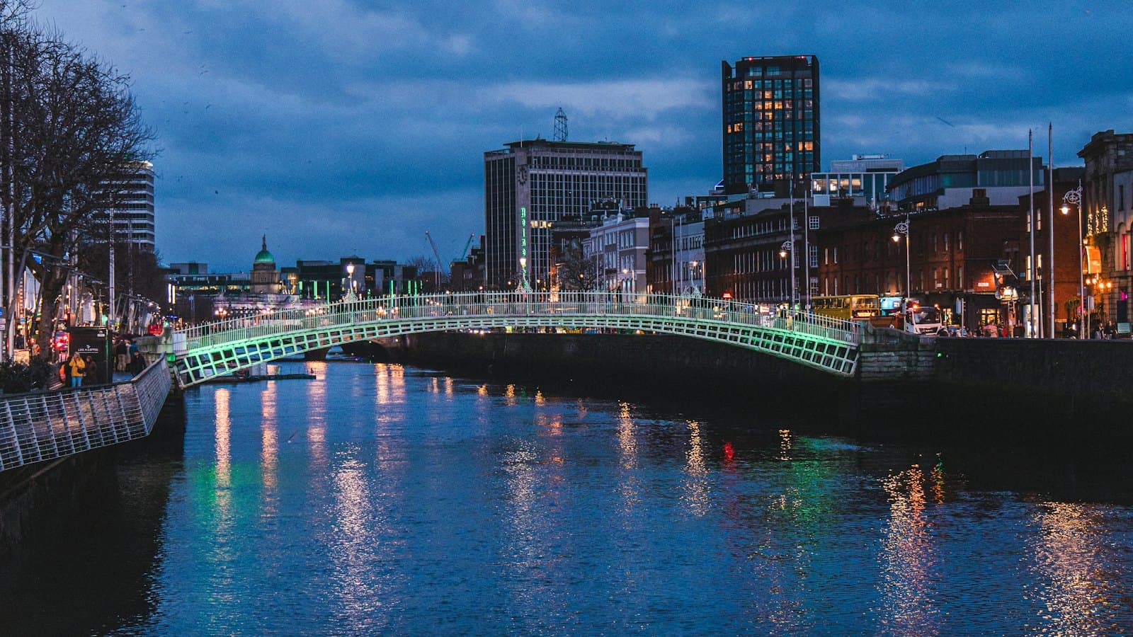 The Ha'penny Bridge lit up over the River Liffey in Dublin