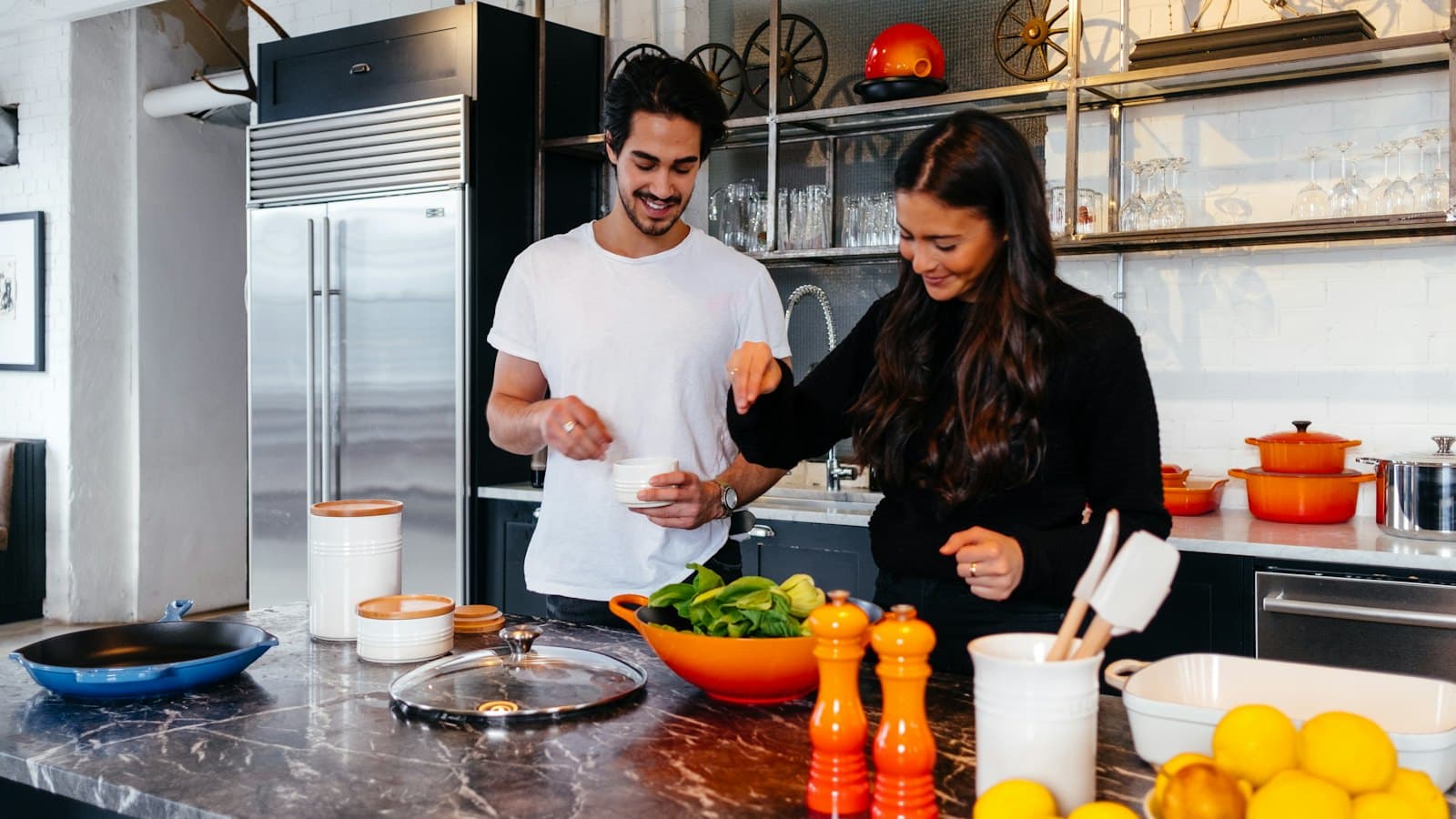 Man and woman cooking a meal together at home