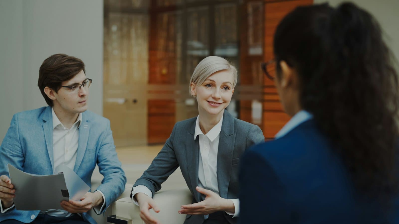 Advisers in a meeting with a client discussing a printed document